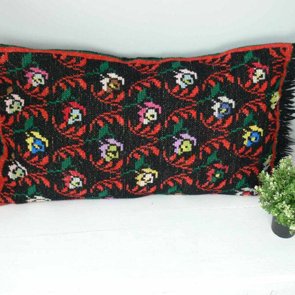 vintage cushion with cross stitch and fringes