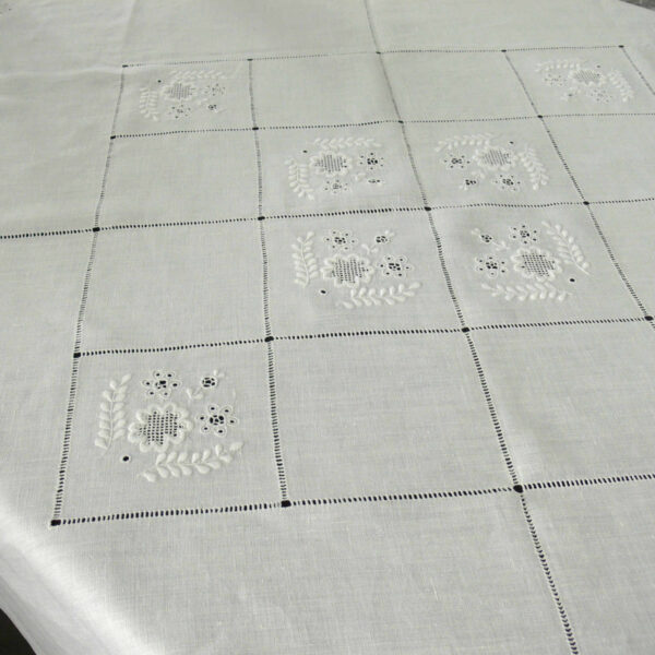 white linen square tablecloth with embroideries